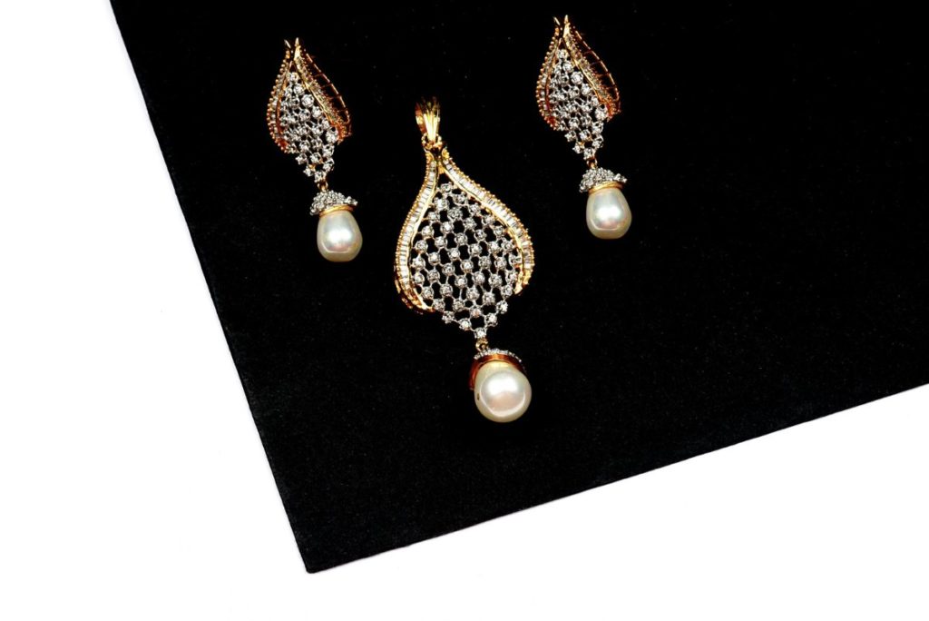 Three pearl diamond earrings