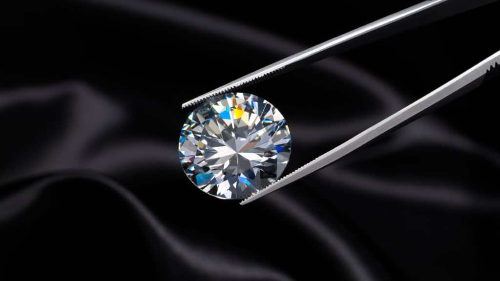 4cs of Diamonds - Alicia J Diamond being held by diamond tweezers